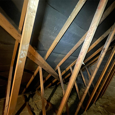 inside view of the roof rafters with very basic insulation first angle