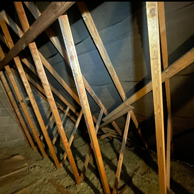 inside view of the roof rafters with very basic insulation second angle